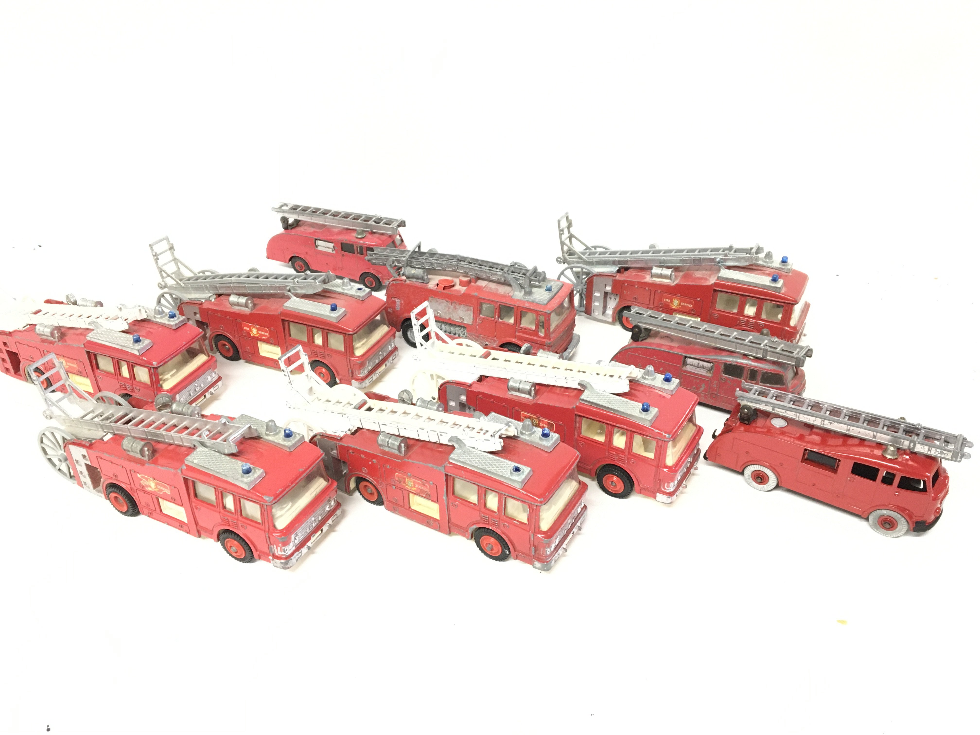 A Collection of Playworn Dinky Fire Engines.
