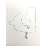 A 9ct white gold cultured pearl and diamond neckla