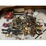 A collection of mixed costume jewellery, watches e