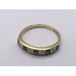 An 18carat gold ring set with alternating sapphire