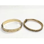 A rolled gold bangle and one other unmarked bangle