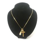 A 9ct gold cross & chain with a small diamond pend