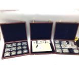 Three cases of collectors coins