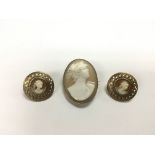 A 19th Century cameo and a pair of cameo earrings