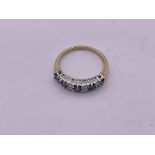 9ct gold diamond/ sapphire 1/2 loop ring. Size L,