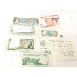 A collection of used bank notes including a 1947 B