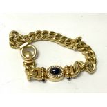 A heavy 18ct yellow gold curb chain bracelet set w