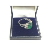 A boxed 18ct white gold oval emerald and marquis d