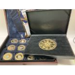 A small collection of gold plated commemorative co