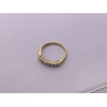 18ct gold, 7 stone diamond 1/2 loop ring. Size O,