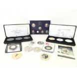 A collection of silver proof sets, four silver coi