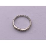 9ct white gold channel set diamond 1/2 loop ring.