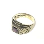 A silver gilt ring set with a red stone NO RESERVE