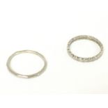 Two platinum rings, total weight of 7.2g. Sizes Q