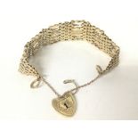 A 9ct gold gate bracelet, 27.4g