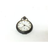 A metal cased button wind pocket watch alarm.