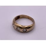 A gents 9ct gold 3 stone gypsy design with inset w