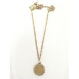 A 9ct Gold necklace with attached half sovereign 1