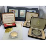 A collection of cased commemorative silver coins t