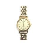 A ladies Longines watch on a 9ct gold strap.