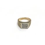 A 9ct gold gents ring set with nine clear stones,