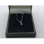 9ct white gold pendant set with a solitaire blue d