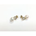 A pair of 9ct yellow gold, pearl and diamond halo