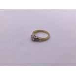 18ct gold diamond solitaire with diamond sides (si