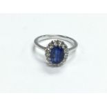 A certificated 18ct white gold oval kyanite and di