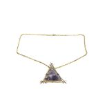 A large amethyst pendant on a 9ct gold chain.