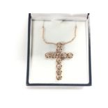 A boxed and certificated 9ct rose gold cross set w