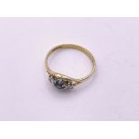 18ct 3 stone diamond/sapphire ring. Size N 1/2, 1.