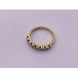 18ct gold 7 stone diamond ring (.65ct). Size M1/2,