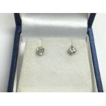 A boxed pair of 18ct white gold diamond studs. RBC