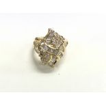 A 14ct gold cocktail ring. Size L and weighing 7.3