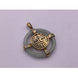 9ct Gold diamond/ jade Chinese symbol pendant. 5.2