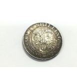 An 1897 one shilling coin.