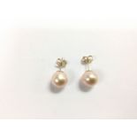A pair of 9ct yellow gold pink cultured pearl stud