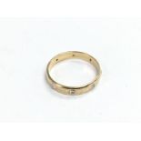 A 9ct gold diamond band, approx size S-T.