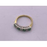 18ct gold emerald/ diamond 1/2 loop ring. Size H1/