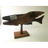 An unusual carved tourist carved hardwood flying fish a souvenir from the Pitcairn Islands made by