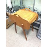 A sewing box raised on legs, approx height 54cm.