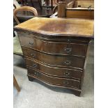 A Mahogany chest of drawers with a serpentine fron