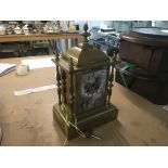 A late Victorian brass mantle clock with painted g