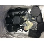 A collection of camera lenses including Nikon exam
