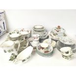 A collection of various ceramic dinner ware and te