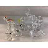 A collection of Swarovski animals including Chimpa