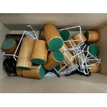 A box of turned wood stands, plate stands etc