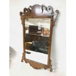 Old antique style wall mirror with carved decorati