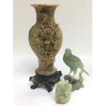 A hard stone vase with applied floral decoration t